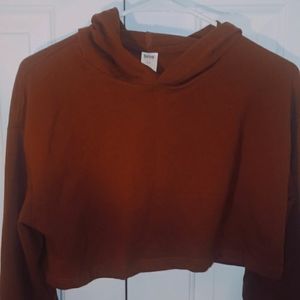 A cropped sweater with baggy sleeves